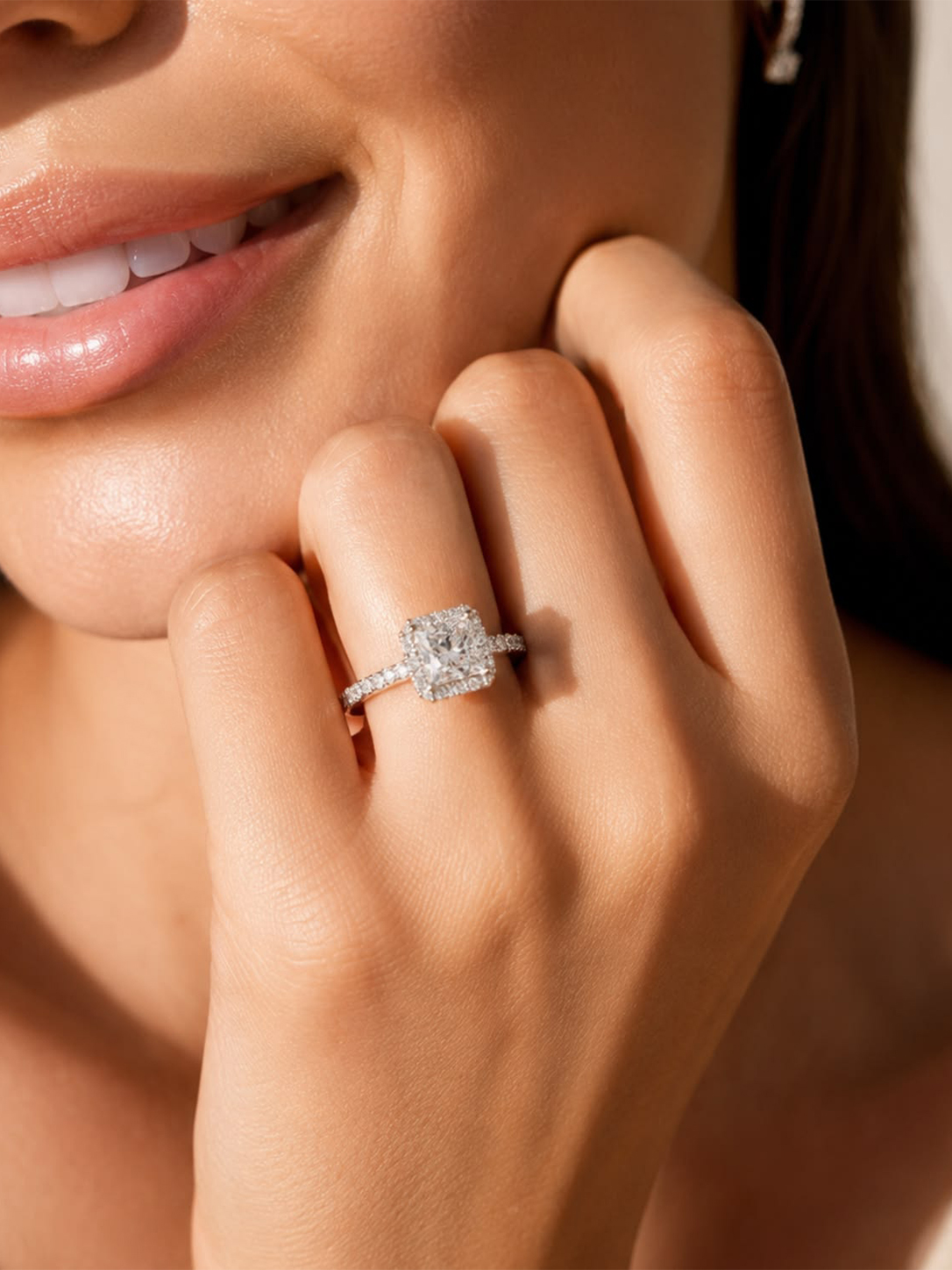 Model wearing diamond engagement ring